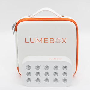 Lumebox device with white and orange design on a light gray background