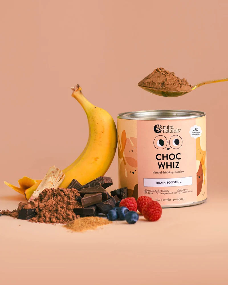 Can of 'Choc Whiz' with chocolate powder, banana, and berries on a beige background