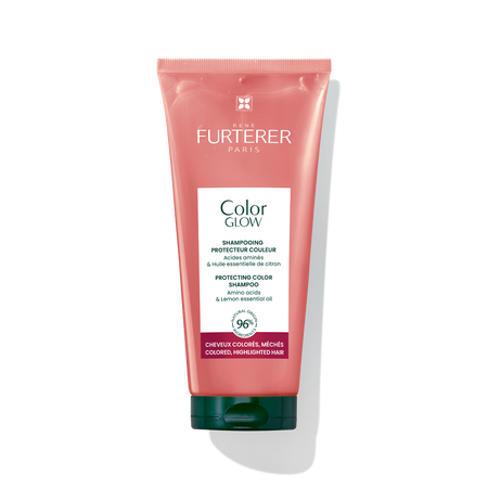 A squeeze tube of Rene Furterer Paris Color Glow Shampoo on a white background with a soft shadow. The tube is a dusty coral pink with a white label and a dark green cap.